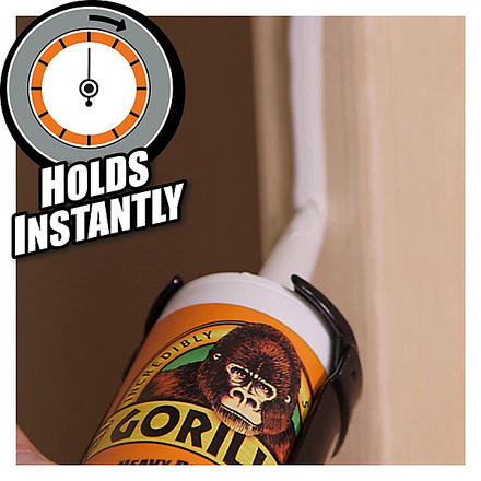 Gorilla Heavy Duty Grab Adhesive being applied to a vertical wooden surface, with a clock graphic highlighting its instant hold properties.